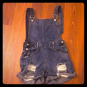 Jean Overalls with cutout back.